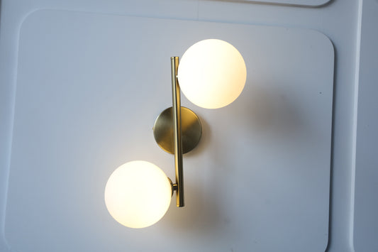 POWERLAM Modern Wall Sconce with 2 Globe Lights, Brass Metal Frame, White Glass Spheres